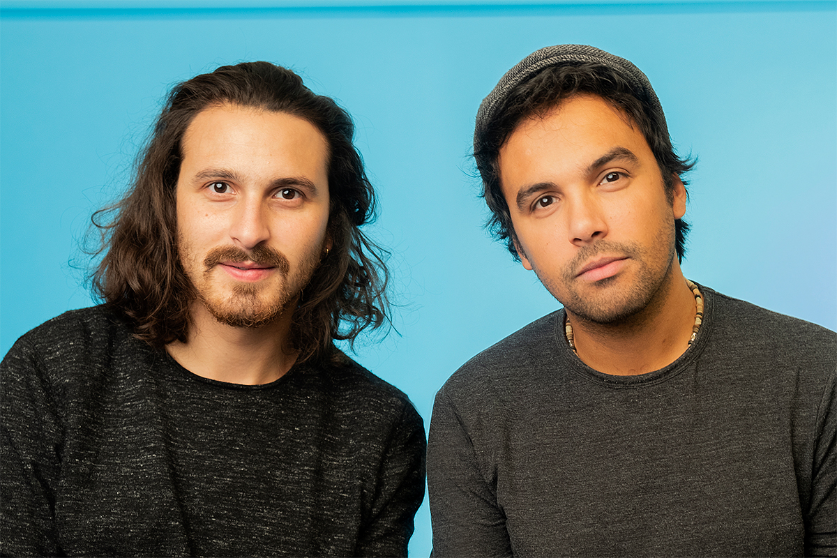 Yaz and Haz against a blue background